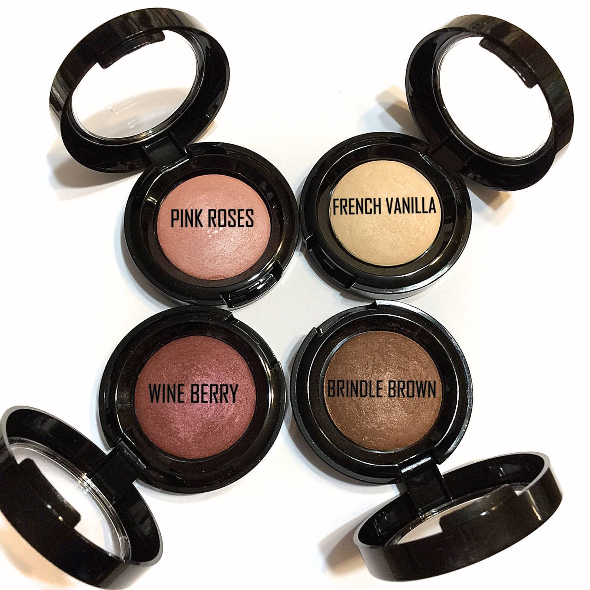Close-up of baked Brindle Brown eyeshadow showing rich, earthy shimmer and smooth pressed texture