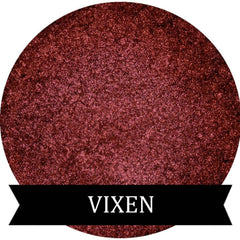 Vixen metallic red eye shadow pot with reflective finish and sleek black compact.