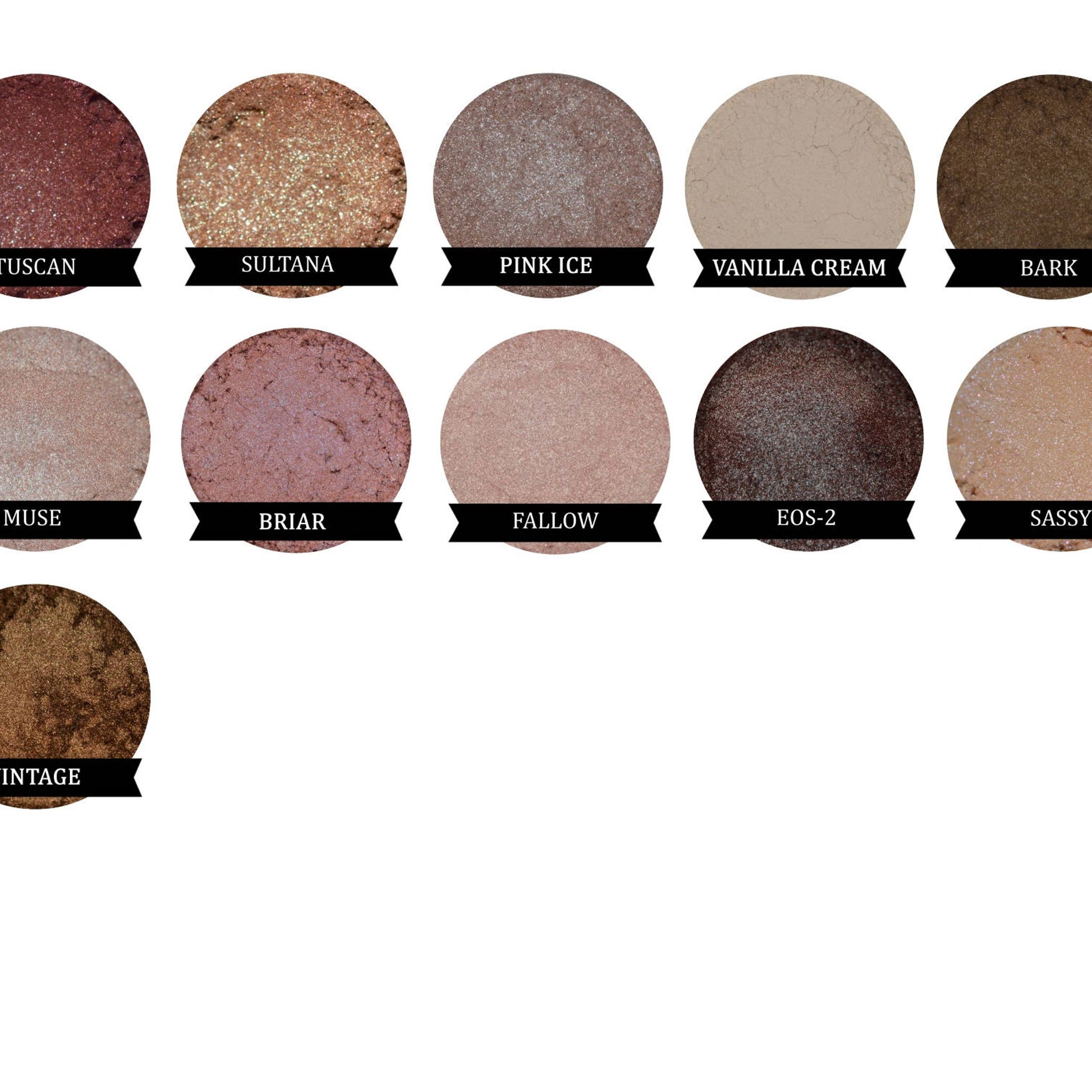 Eyeshadow palette with various colors, including brown, pink, and beige, with a shimmer finish, labeled with names