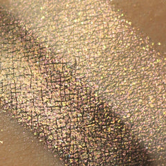 Close-up of Pixie Gems holographic eye shadow pot in Treasure Trove Gold with shimmering multi-dimensional particles