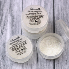 Close-up of natural gold holographic eye shadow with shimmering glitter particles in textured dust form
