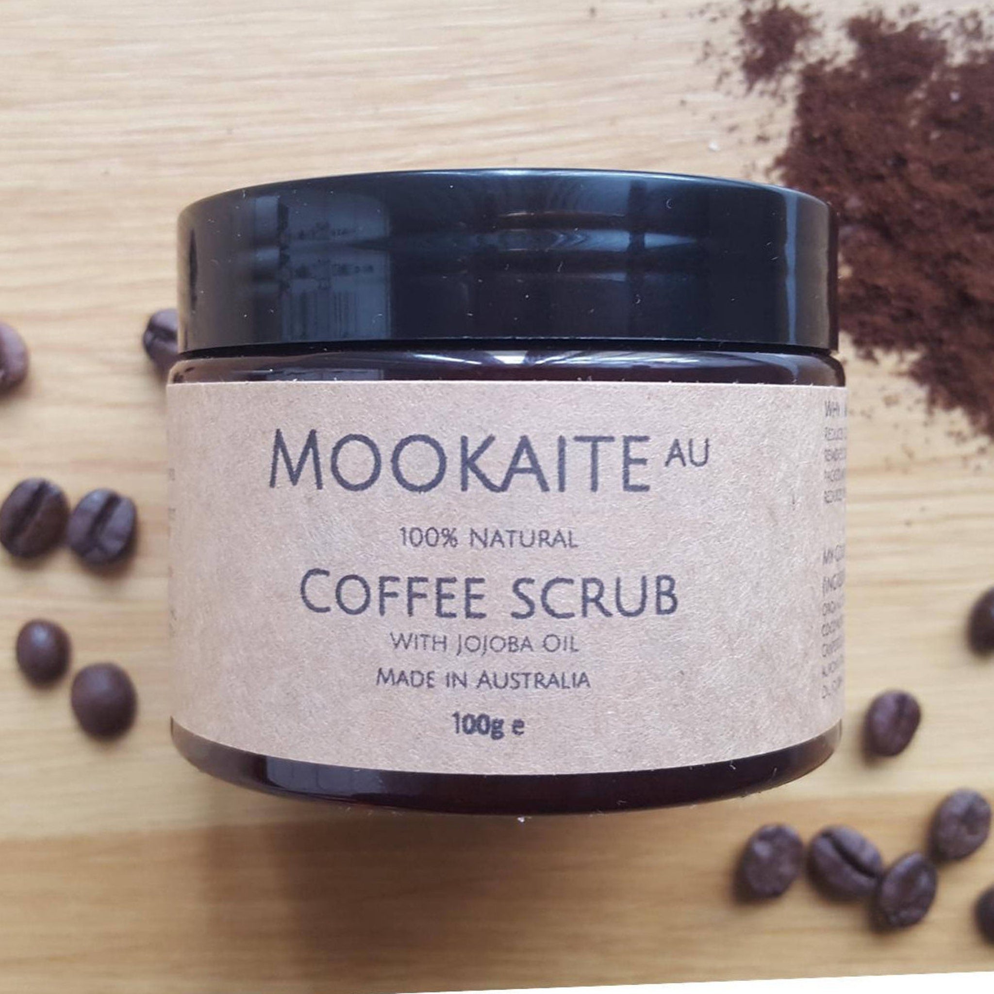 Coffee scrub jar with black lid, brown label, and MookaiteAU brand name displayed