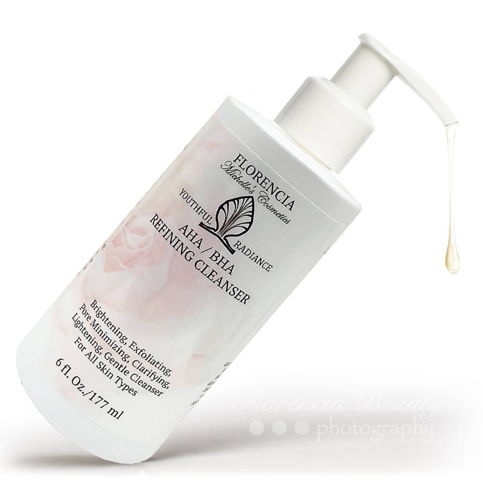 Refining cleanser bottle, white plastic, floral design, with liquid dispensing from pump