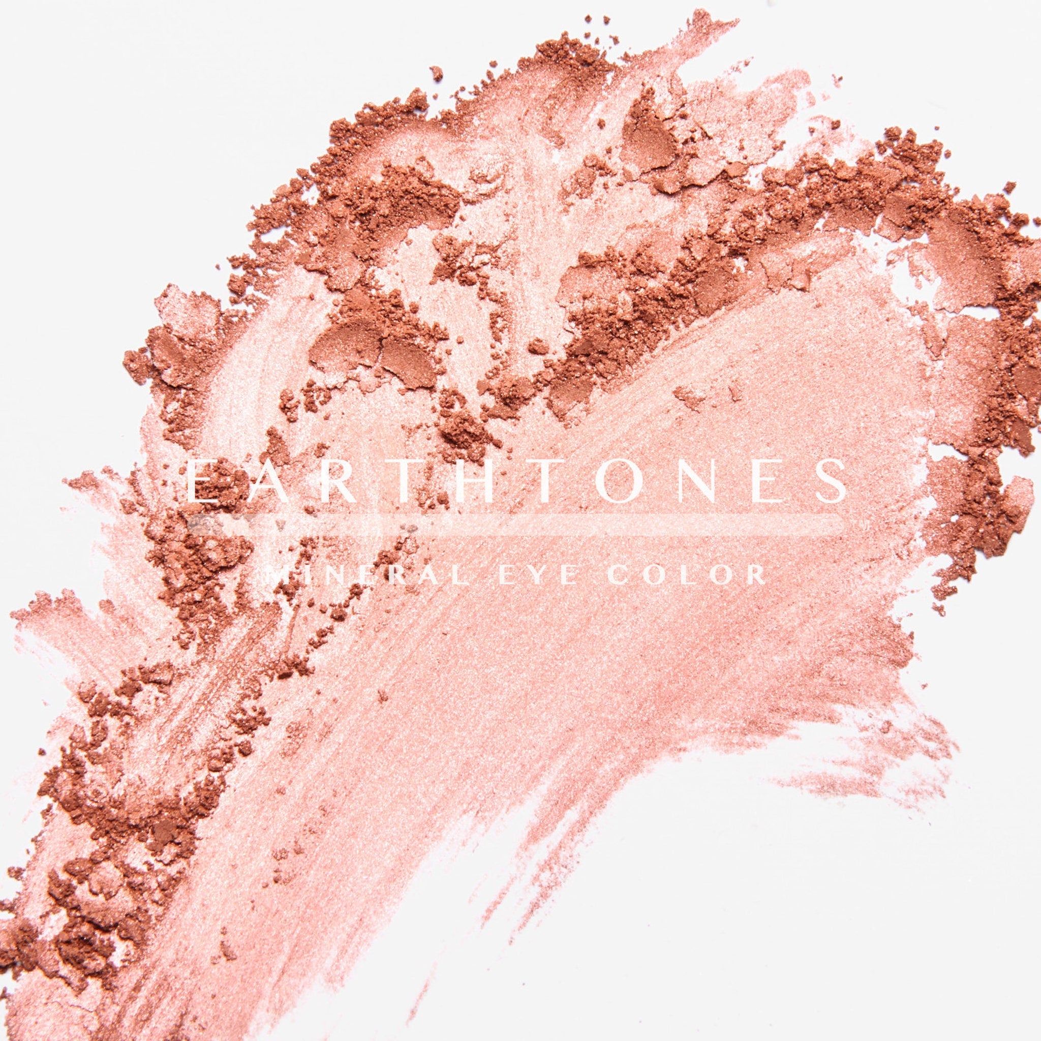 Hand applying rosy shimmer mineral eye shadow with fingertip for a soft blended look