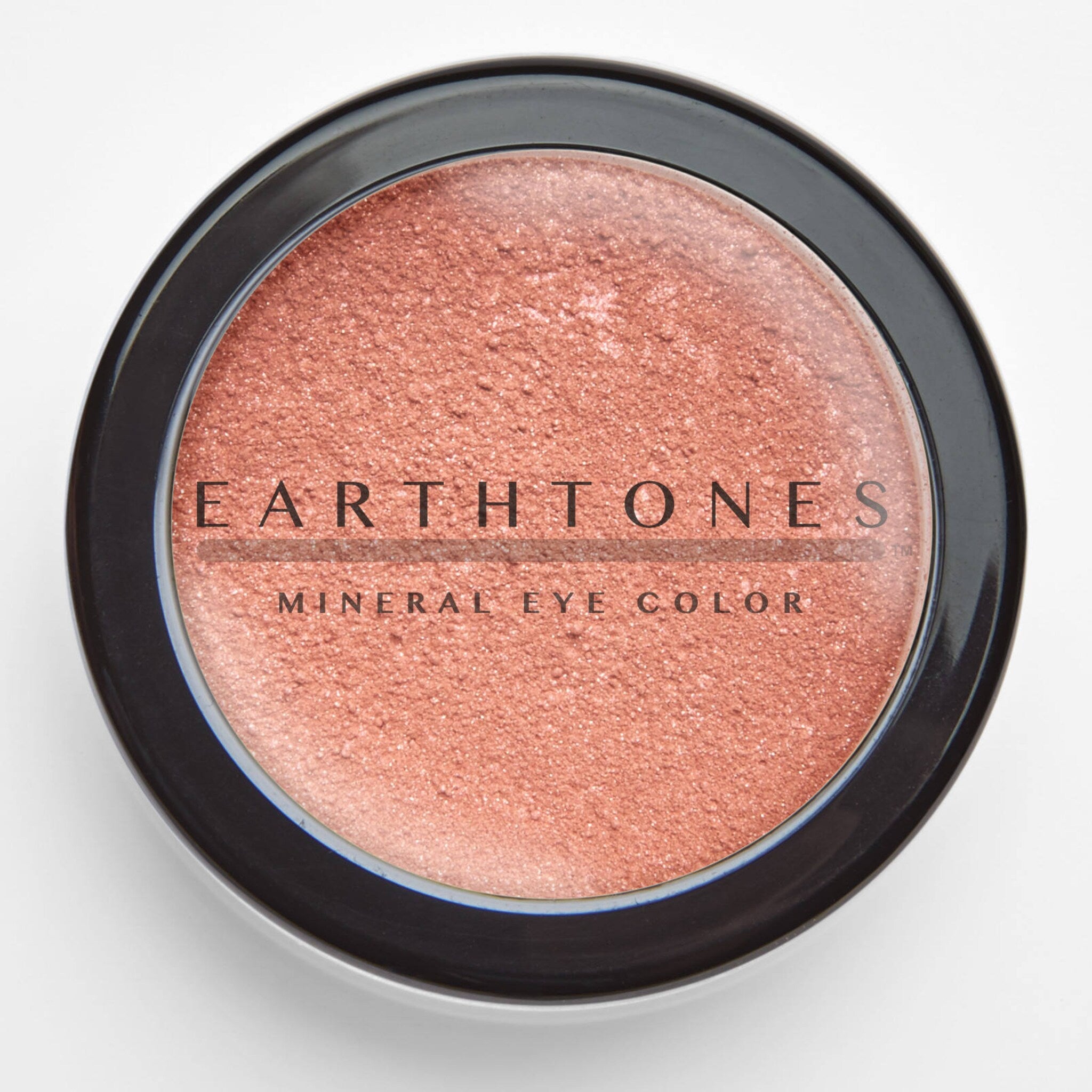 Open compact showing pressed rose gold mineral eye shadow with shimmer particles