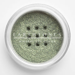 Side view of mint green shimmer mineral eye shadow pot showing reflective metallic finish