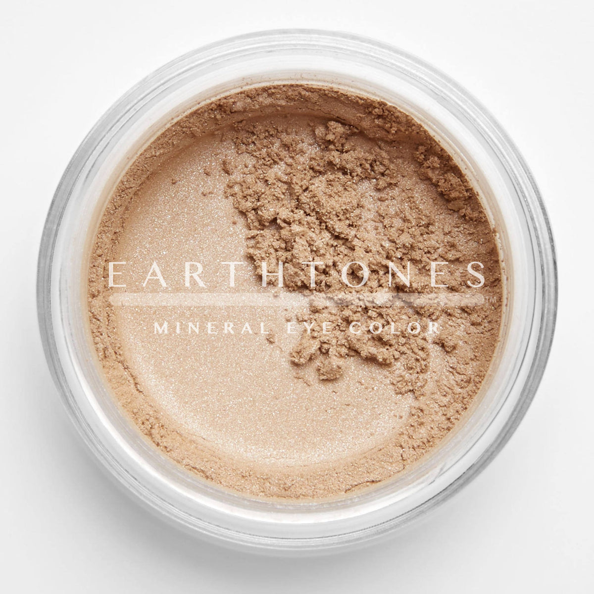 Peach shimmer mineral eye shadow in compact with golden lid, showcasing soft powder texture and warm undertones