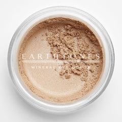 Peach shimmer mineral eye shadow in compact with golden lid, showcasing soft powder texture and warm undertones