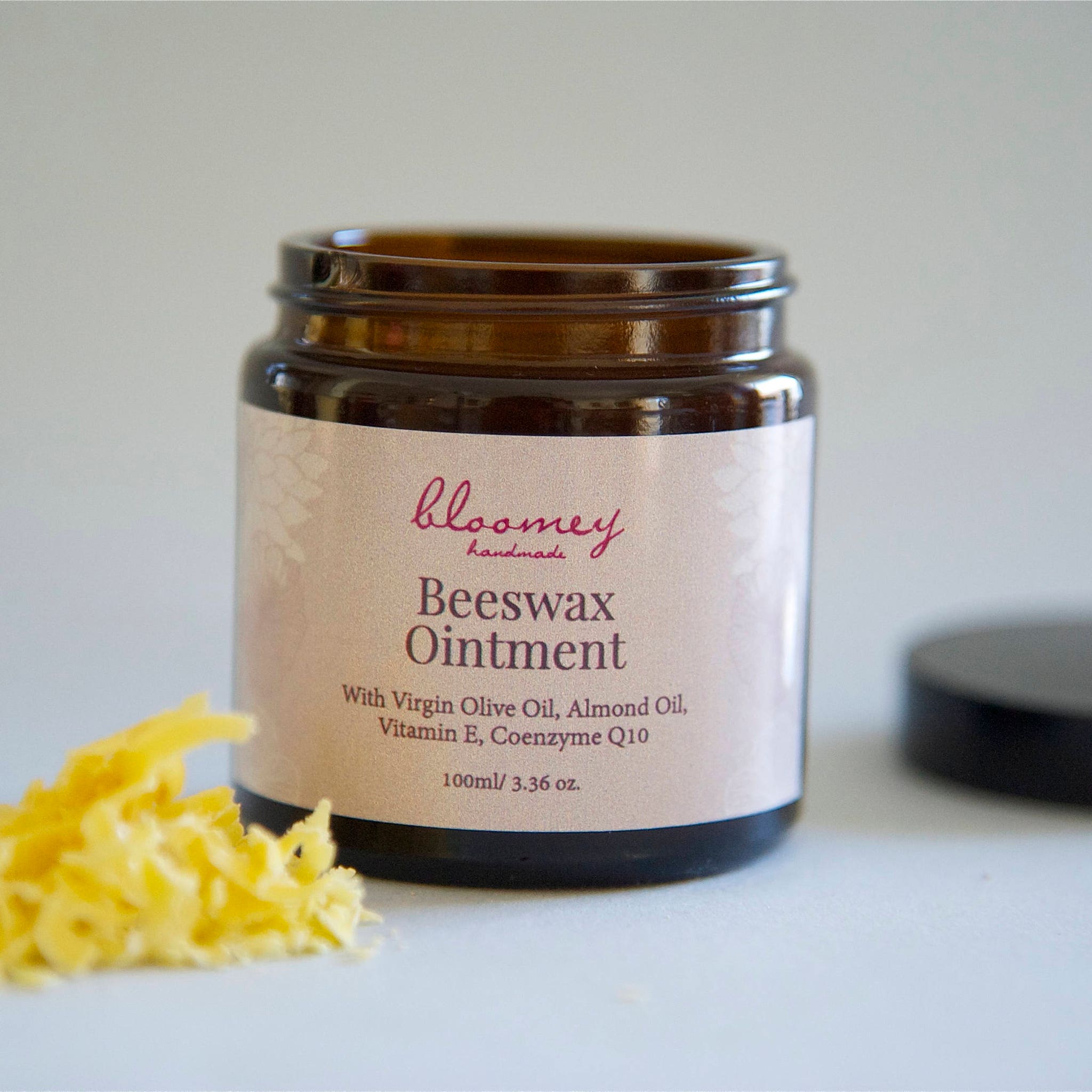 Beeswax Ointment in brown glass jar with label, Bloomey Handmade brand visible