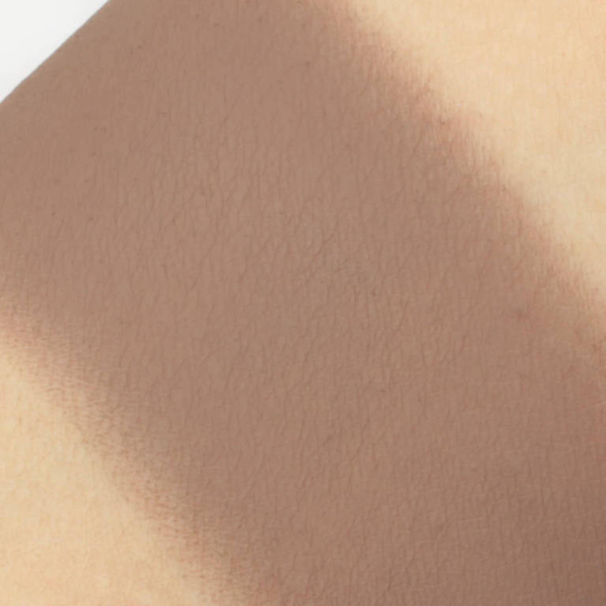 Skin texture with light brown color and subtle lines, close-up view