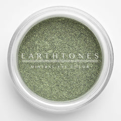 Close-up of mint green shimmer mineral eye shadow with soft reflective sparkle and smooth powdery texture