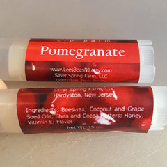 Lip balm tubes with red labels and white text, Pomegranate flavor, Lees Bees NJ Etsy brand