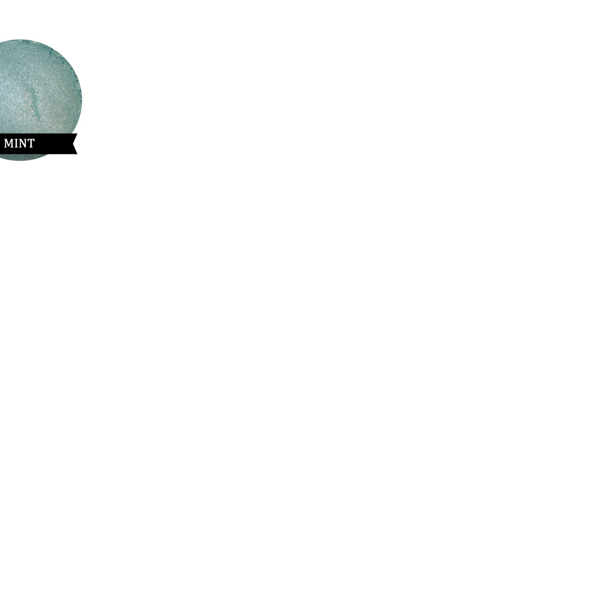 Side view of mint green eyeshadow pan showing soft matte texture and spring-inspired hue