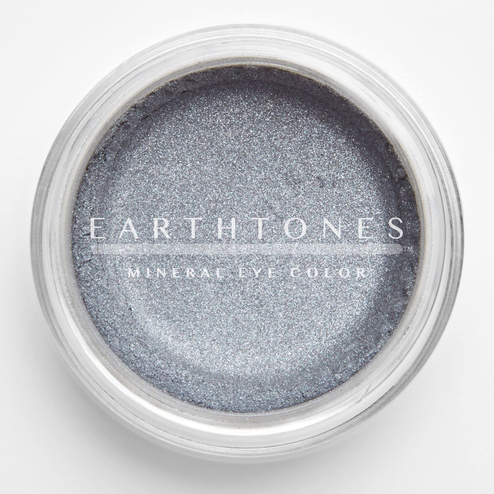 Silver mineral eye shadow in compact case with smooth metallic finish and shimmering pigment.