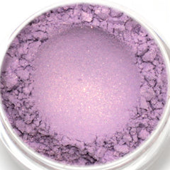 Eyeshadow powder in lavender color with shimmery finish in a clear jar, close-up view