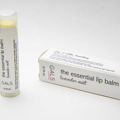 Lip balm tube with white label, clear cap, and yellow balm inside, GALS brand