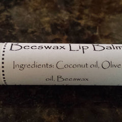 Beeswax Lip Balm white paper tube with black text, ingredients listed, Crooked River Naturals product