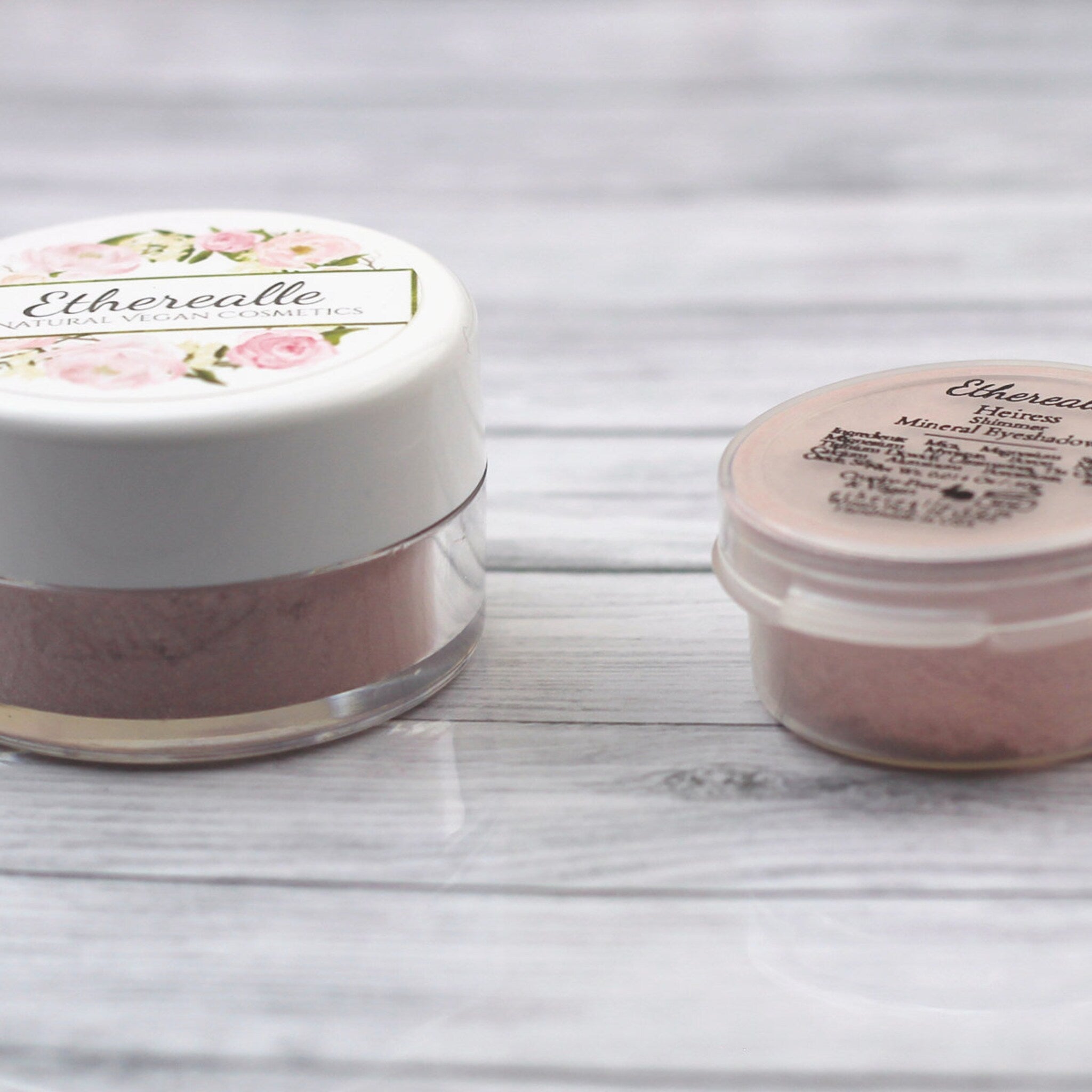 Open compact showing Heiress vegan mineral eyeshadow in light golden pink with mirror and applicator