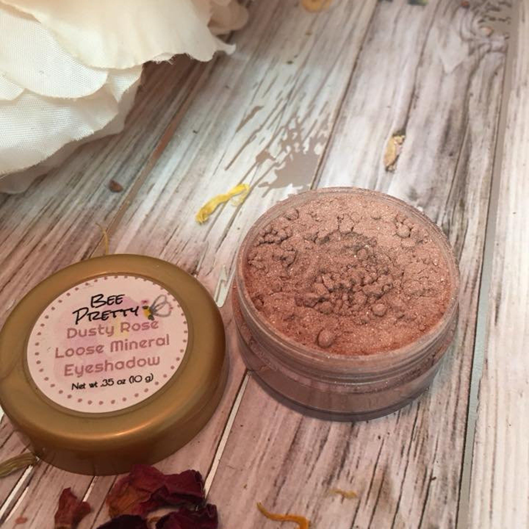 Side view of Dusty Rose loose mineral eyeshadow in a 5g jar with vegan label, showcasing fine powder texture