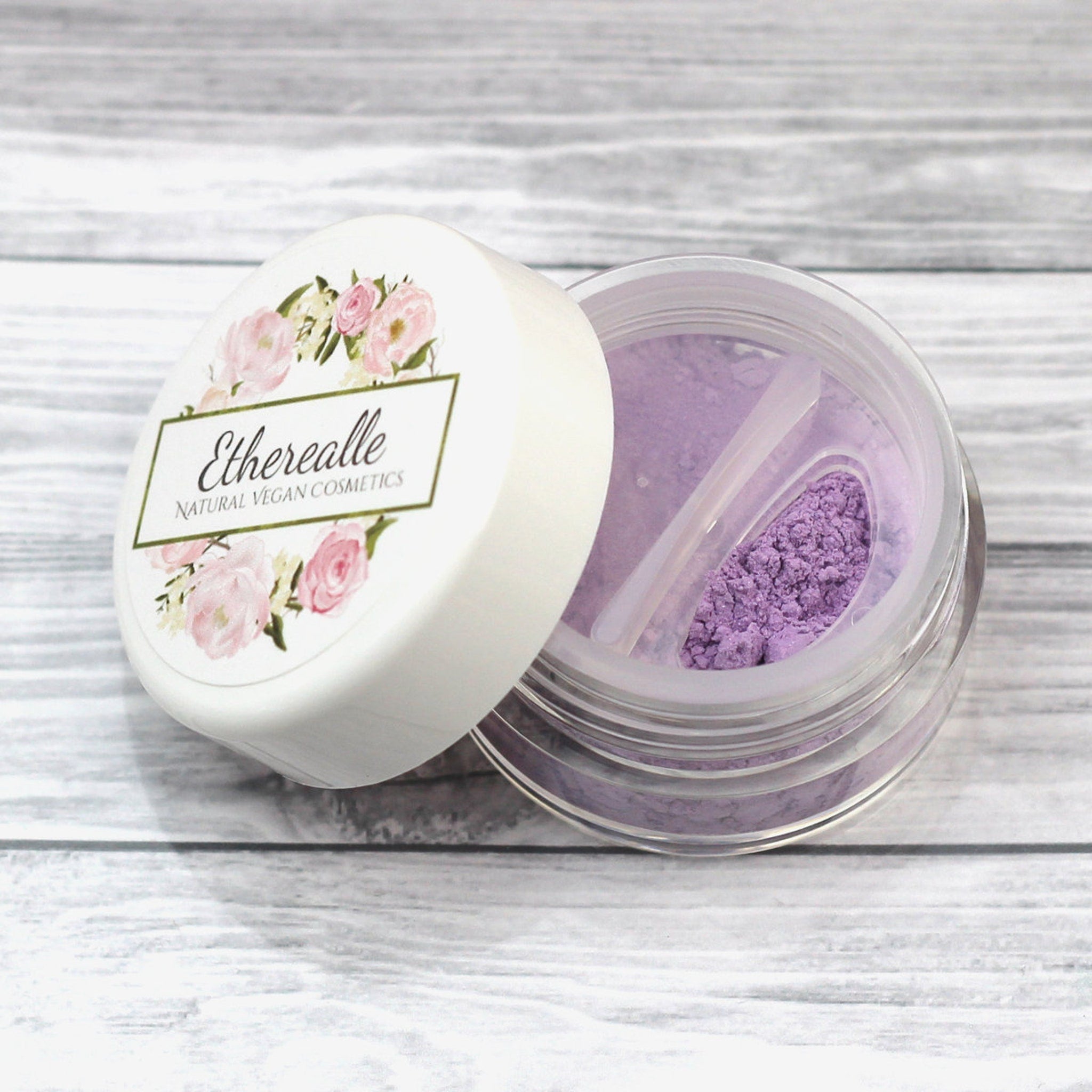 Etherealle Natural Vegan Cosmetics powder, purple, clear jar, white lid with floral design