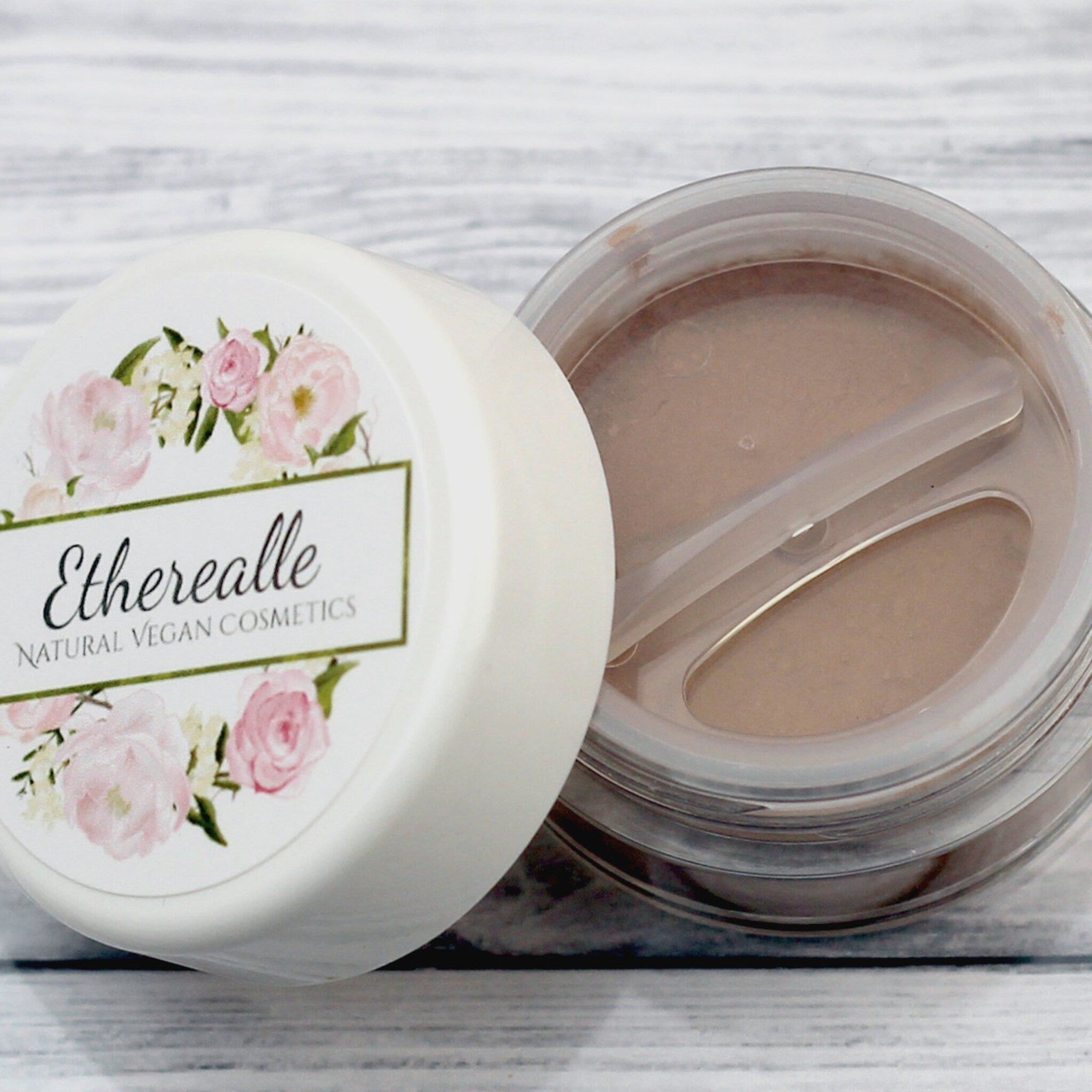 Etherealle powder container, white lid with floral design, clear container with powder inside