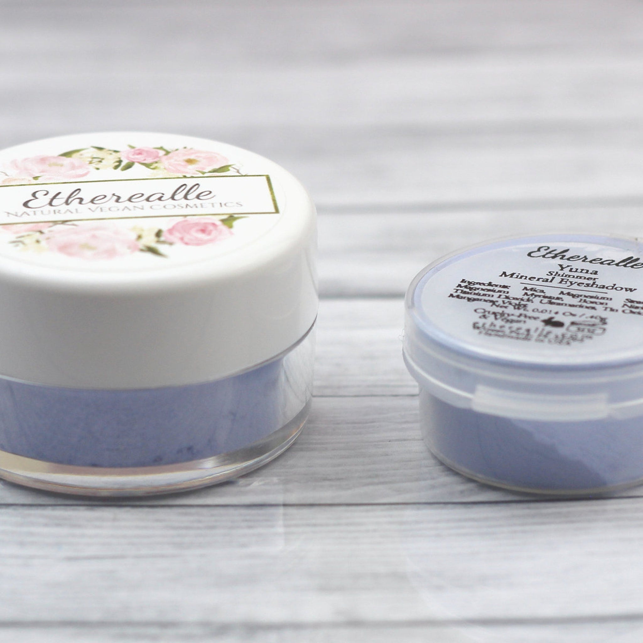 Close-up of light blue shimmer eyeshadow pan with sparkling mineral finish and vegan formula