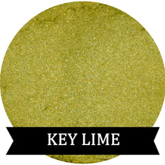 Close-up of vibrant lime green eye shadow pot with smooth matte finish and silver compact case