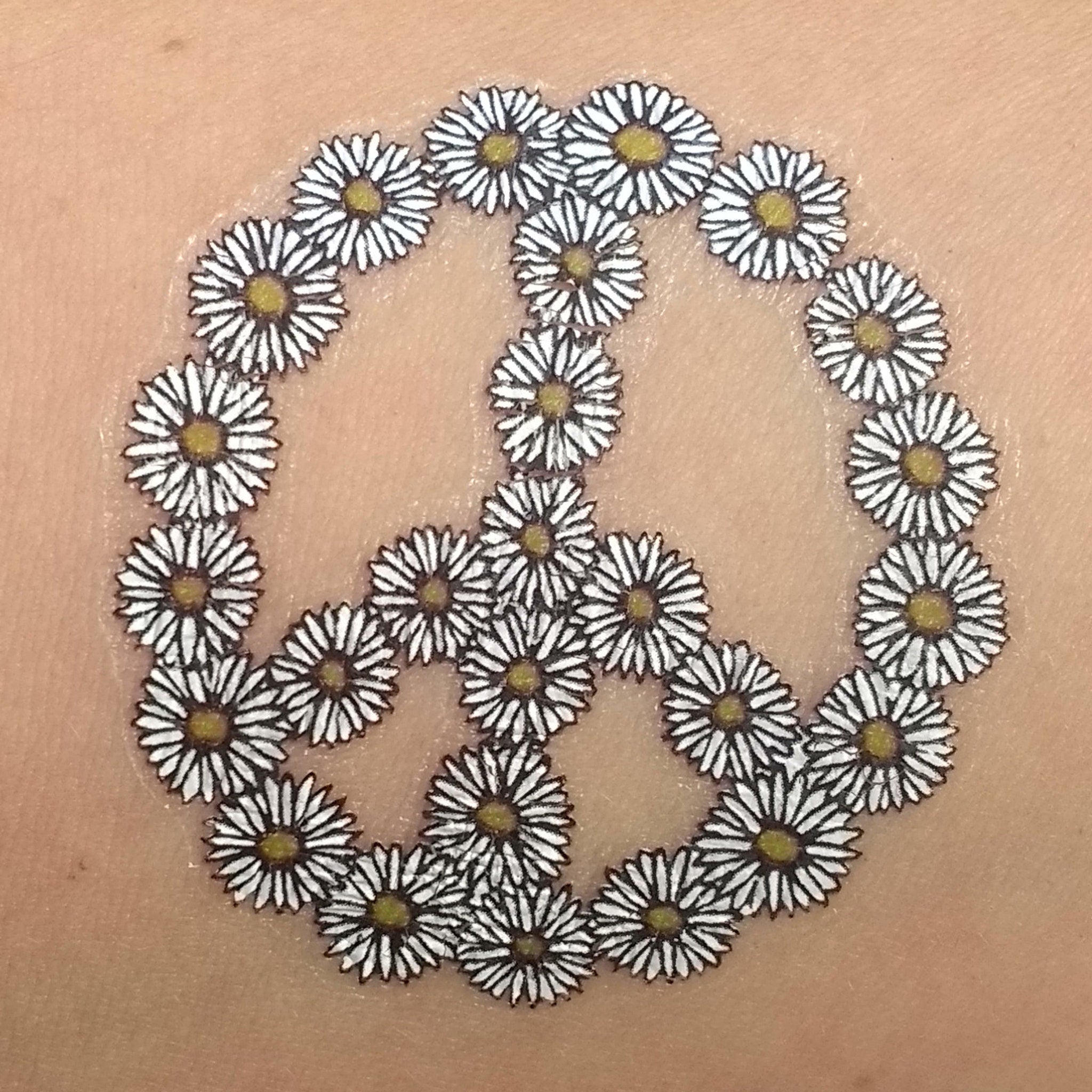 Alternative angle of 60s Flower Power Daisy Chain Temporary Tattoos for Festive Skin Art 