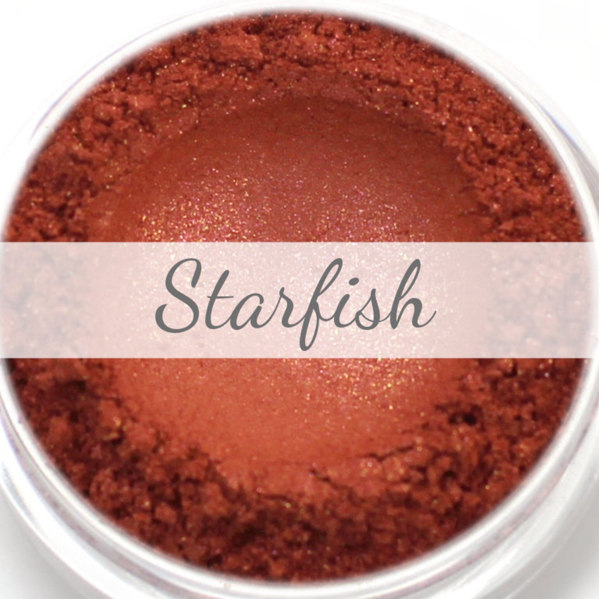Starfish eyeshadow, reddish-brown powder with shimmer, in clear jar with text label