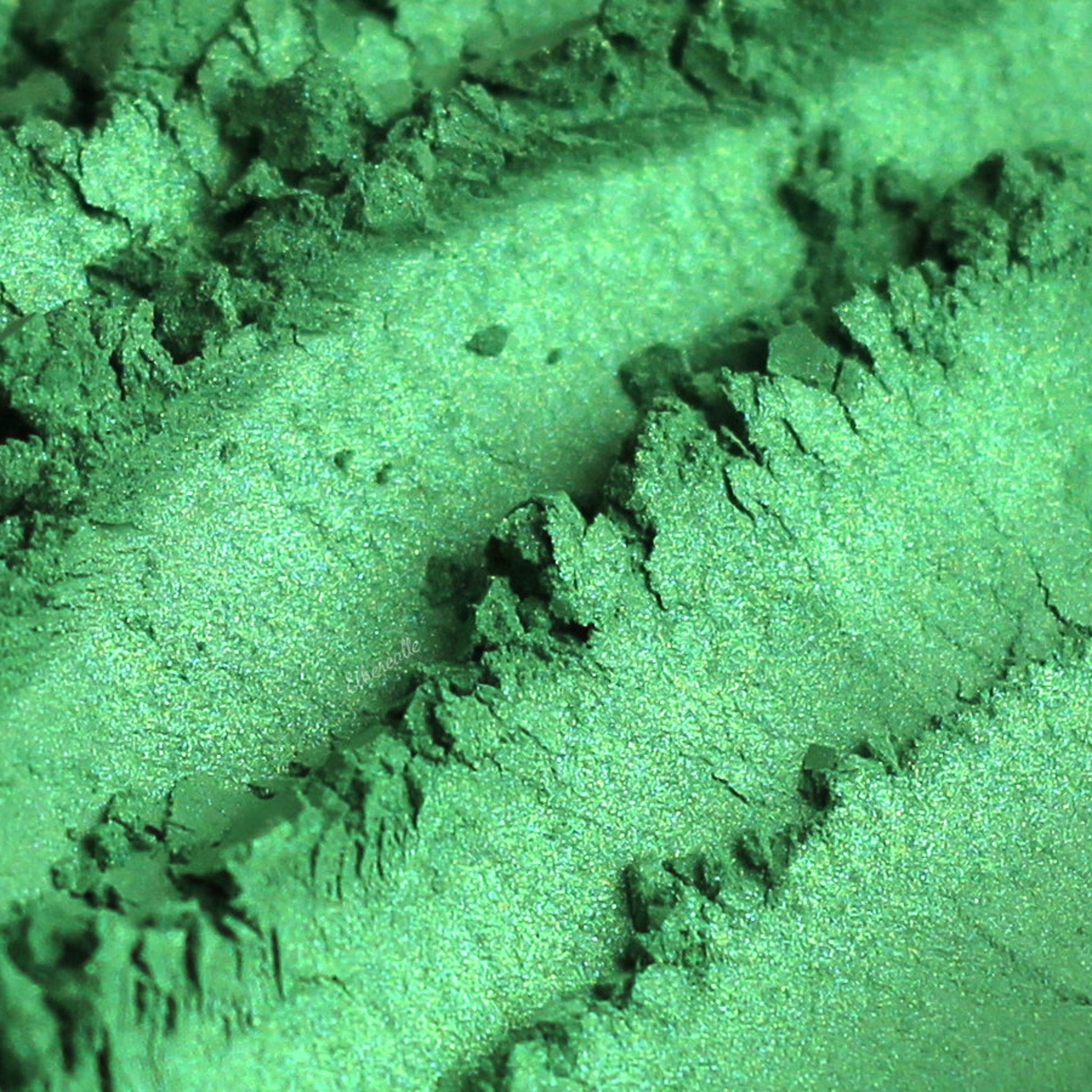 Emerald eyeshadow, textured green powder, with visible Etherealle brand name