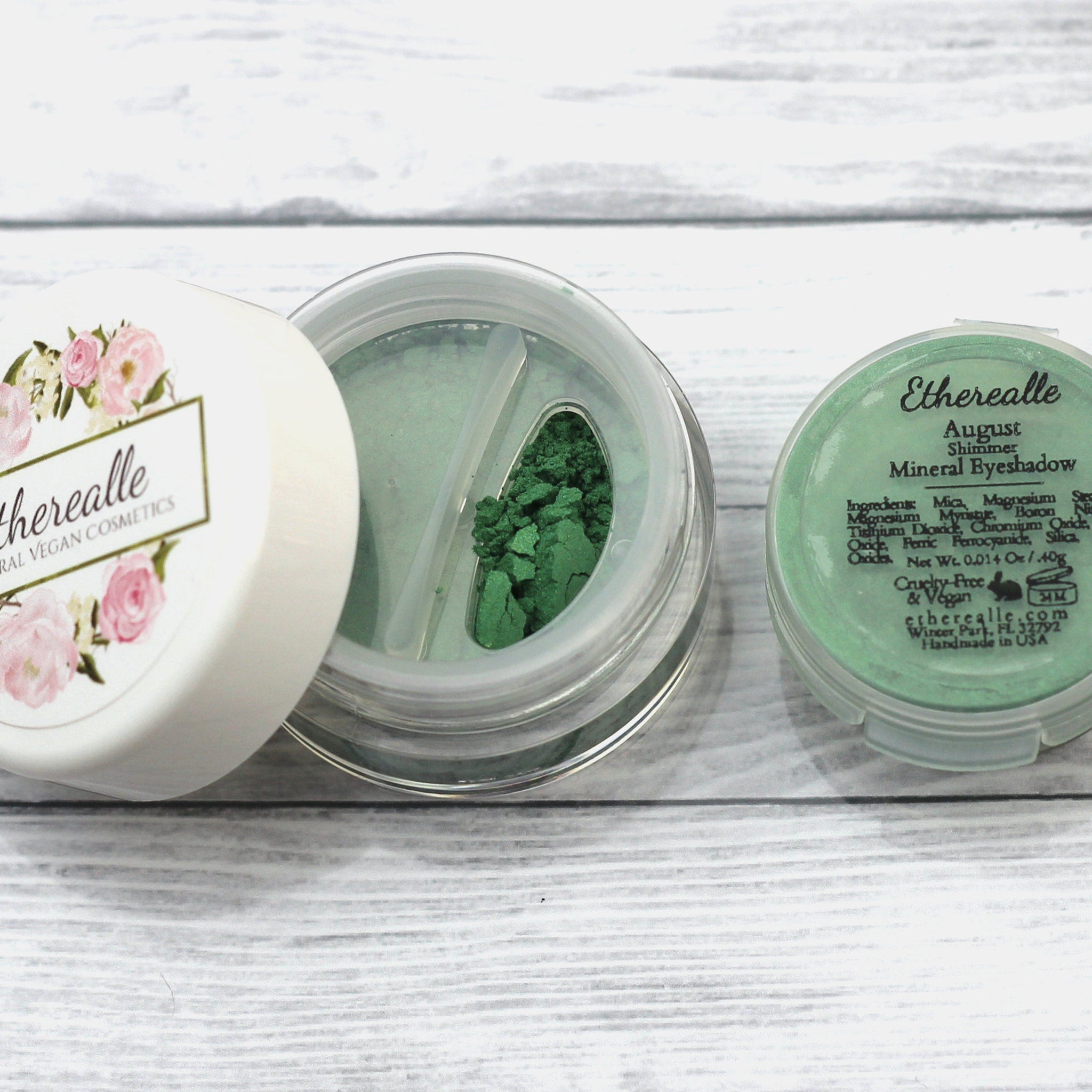Mineral eyeshadow in green, August Shimmer, with Etherealle branding on the lid and container