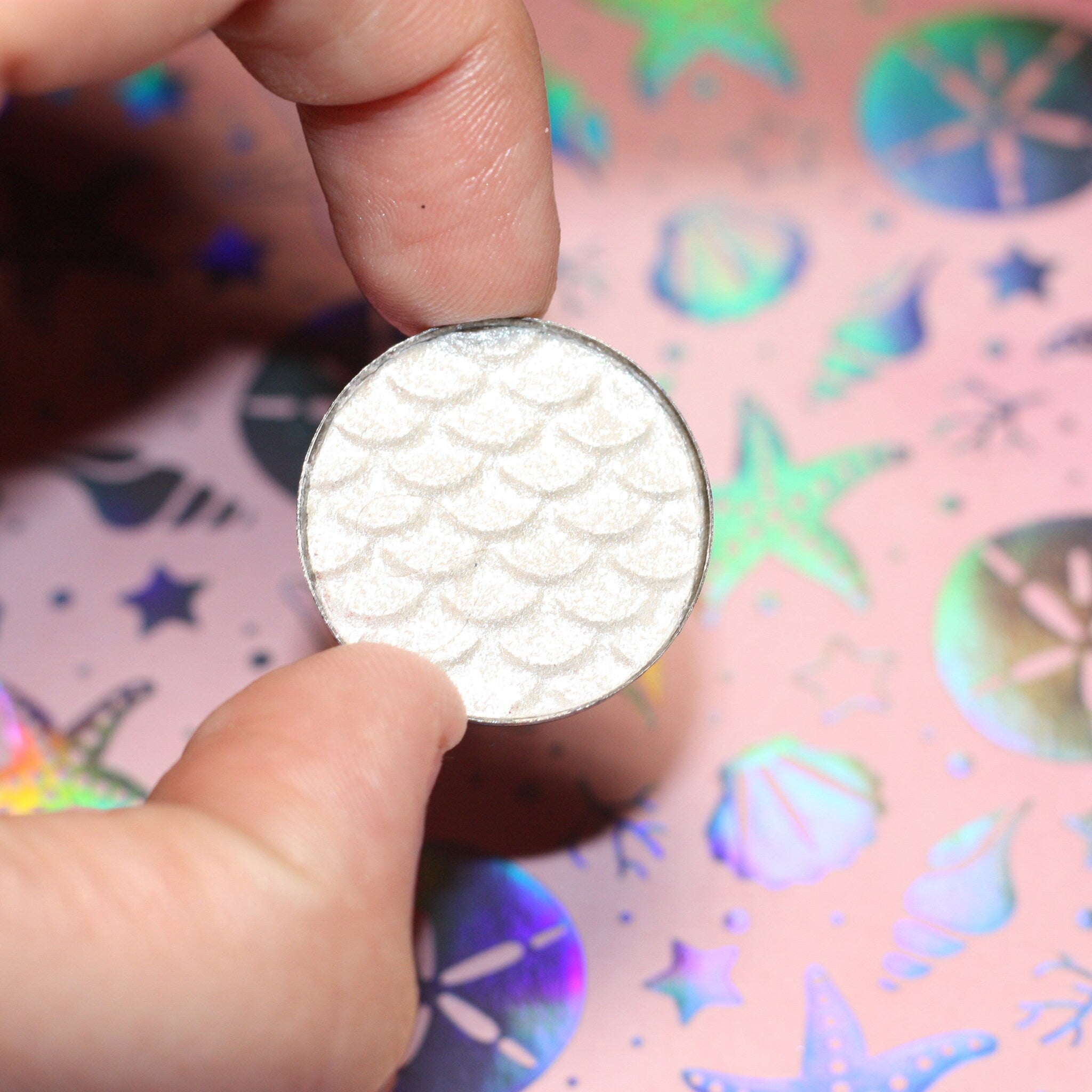 Close-up of Leia Eye Shadow palette showing shimmering bronze and taupe shades with smooth, blendable texture
