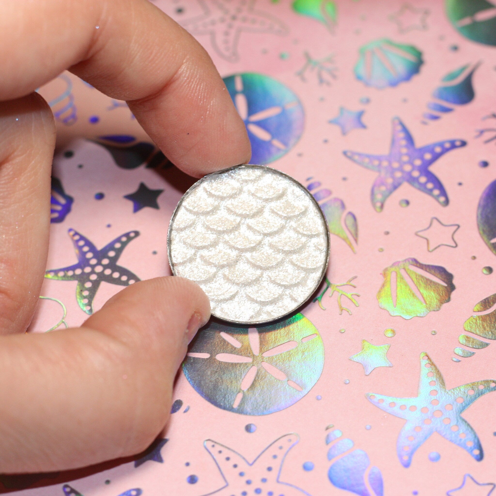 Leia Eye Shadow compact open to reveal shimmering bronze powder with mirrored interior and sleek black case