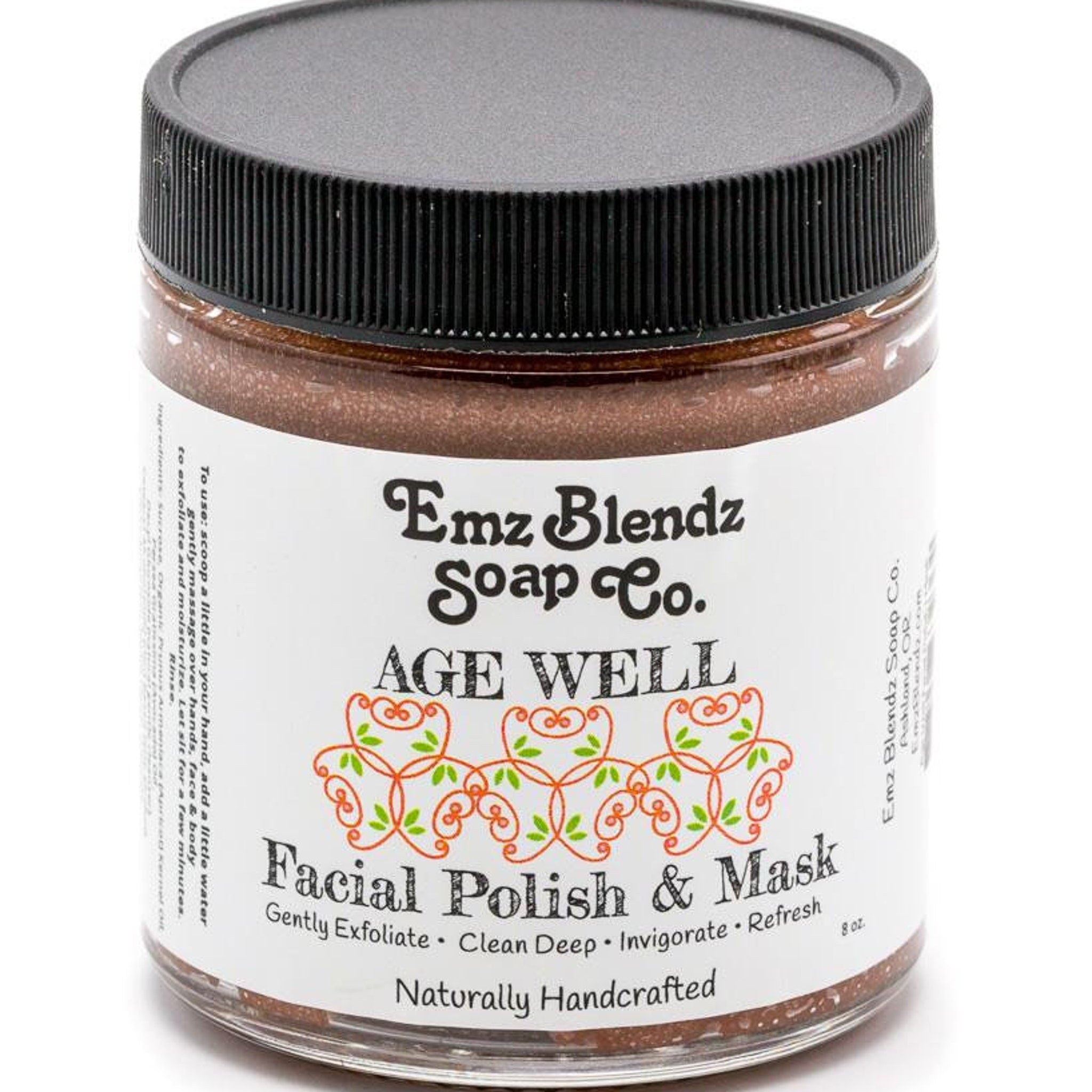 Sugar scrub jar with black lid, brown contents, and Age Well label