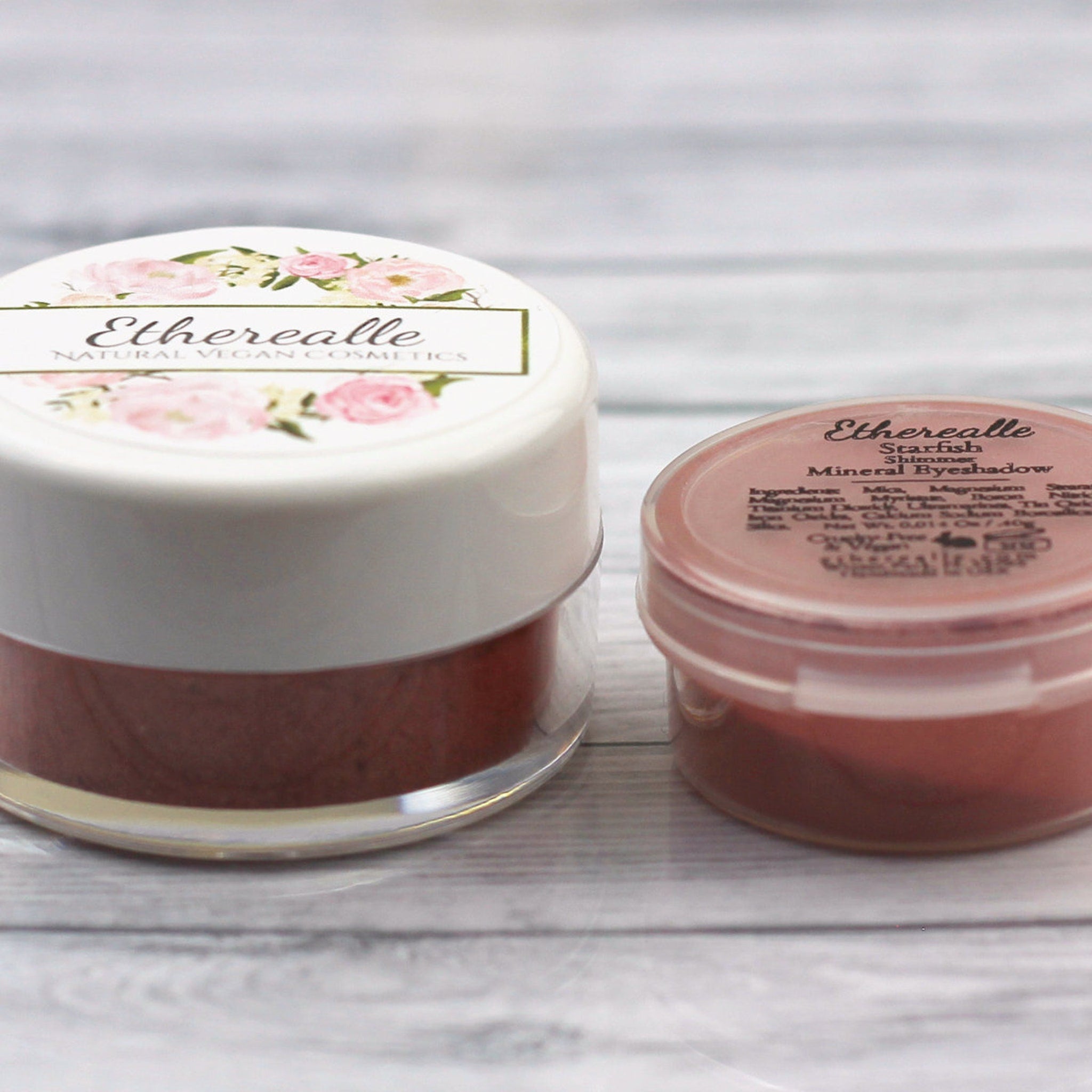 Mineral eyeshadow pots, clear glass and white plastic containers, Etherealle brand name visible on label