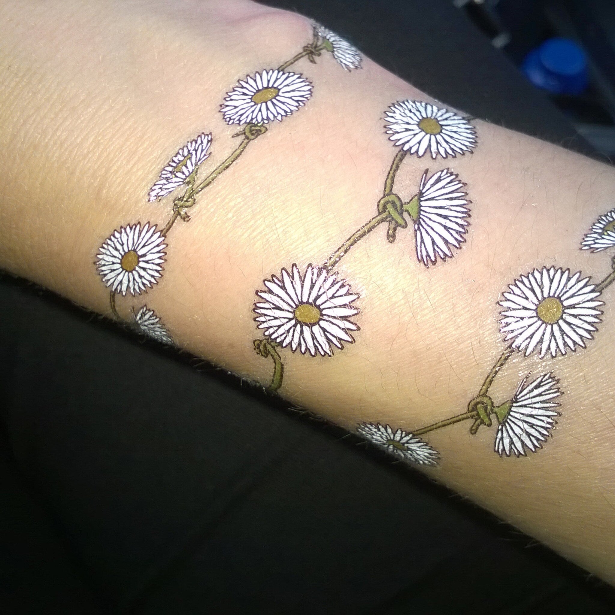 Usage example of 60s Flower Power Daisy Chain Temporary Tattoos for Festive Skin Art 
