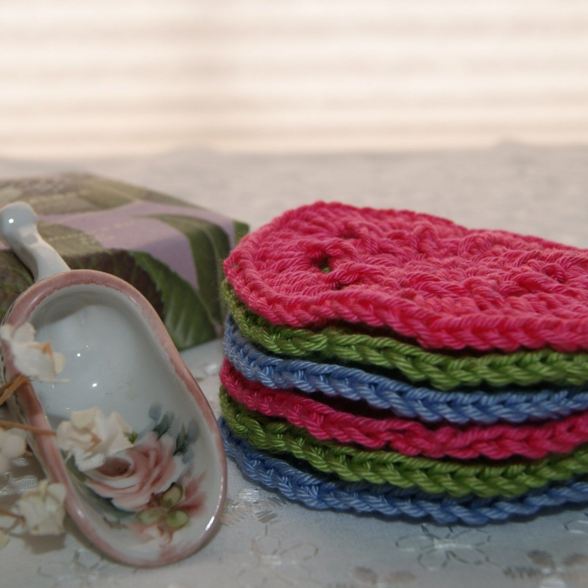 Facial cleansing pads, stacked, multi-colored crocheted cotton rounds, spa accessory