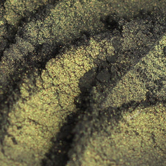 Black mineral eyeshadow compact with intense gold shimmer particles, vegan formula