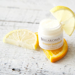 Lip butter jar with white label, orange and yellow fruit slices, BellaRoma Boutique branding