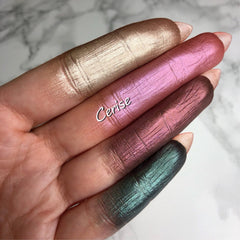 Close-up of vegan duochrome foiled eyeshadow in shifting metallic hues with smooth pressed powder finish