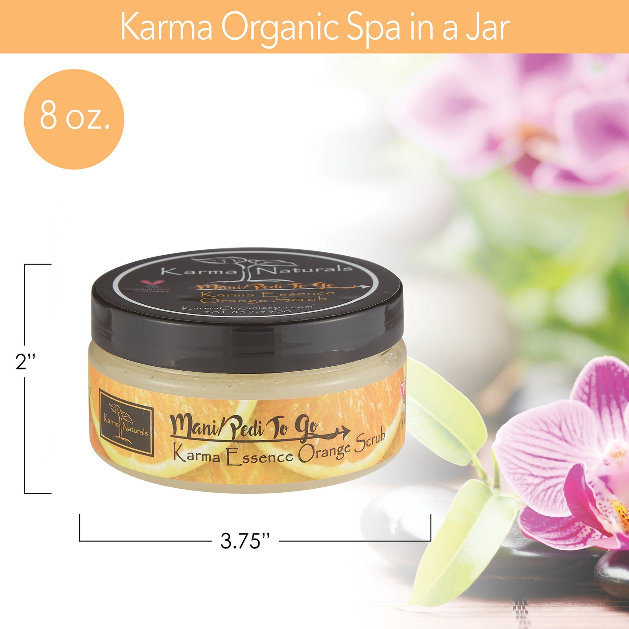 Orange scrub jar with black lid, Karma Naturals label, and orange fruit design on jar