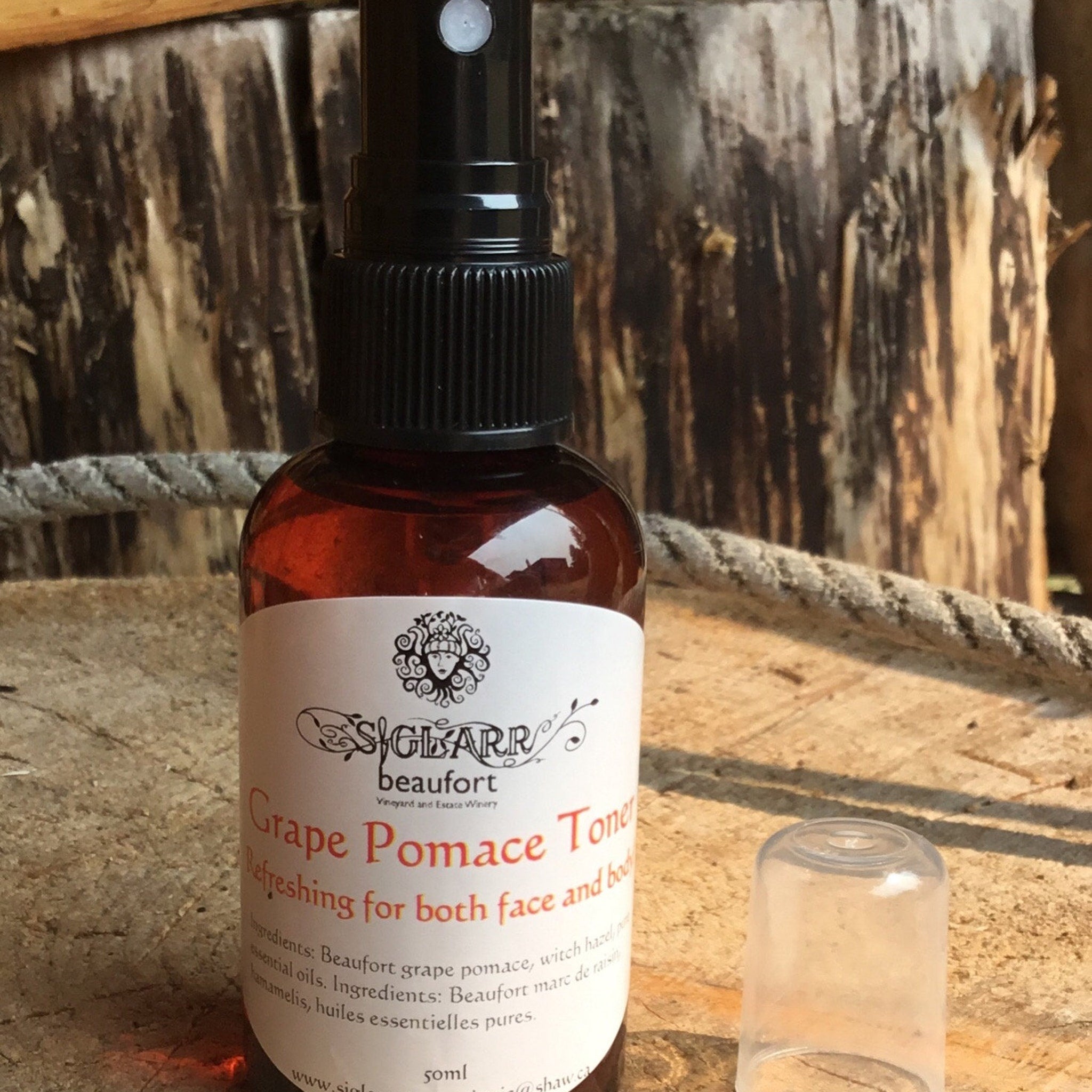 Toner bottle with brown liquid, black spray top, and white label, by SIGLARR brand