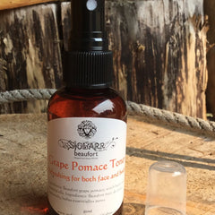 Toner bottle with brown liquid, black spray top, and white label, by SIGLARR brand