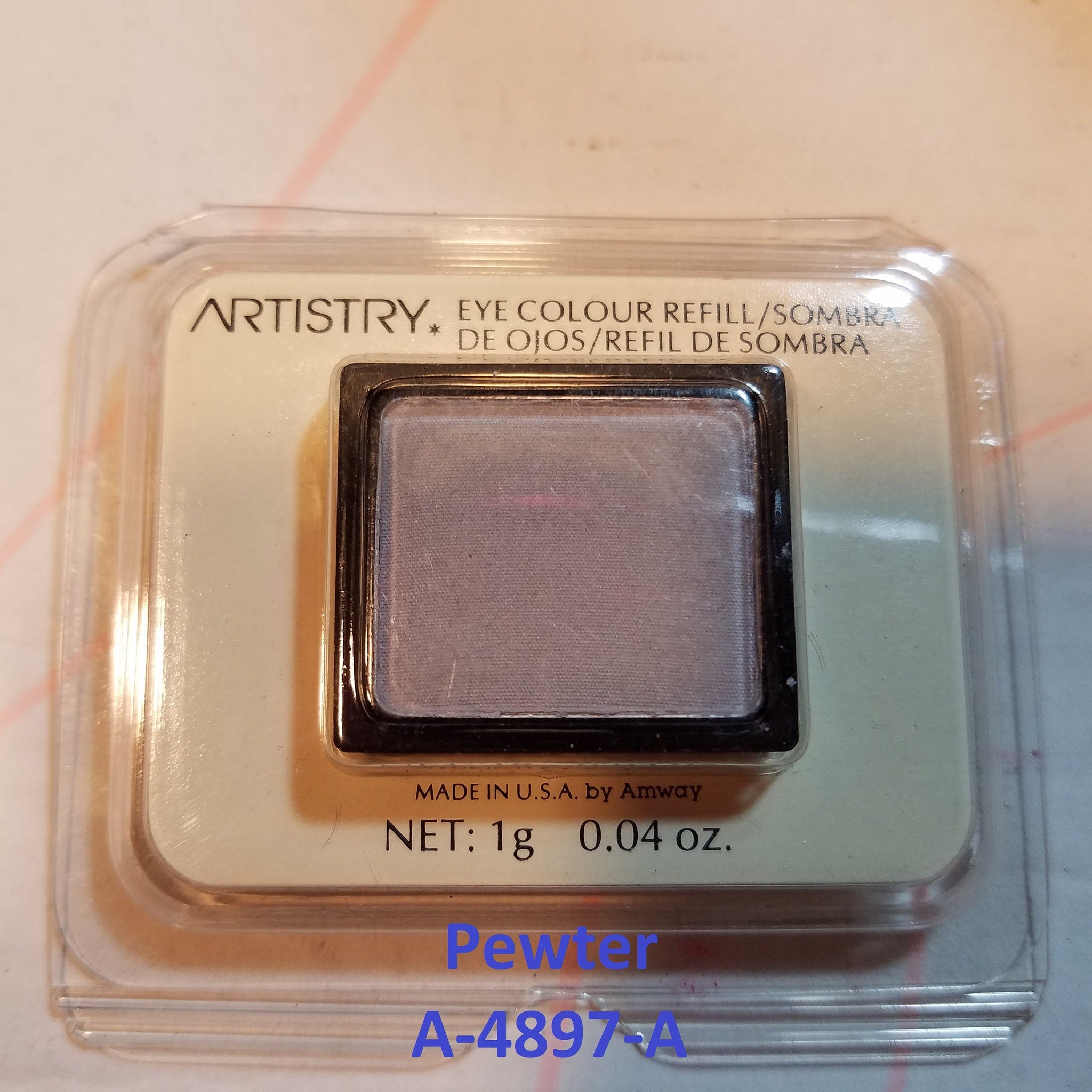 Open Vintage Artistry eye shadow palette showing seven discontinued gray and pink powder shades in rectangular pans.