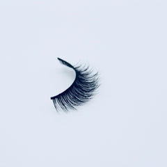 False eyelash, black synthetic lash with curved style on white background