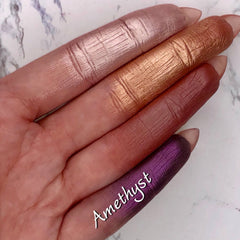 Close-up of amethyst duochrome foiled eyeshadow pan with metallic purple and pink shift, vegan mineral formula