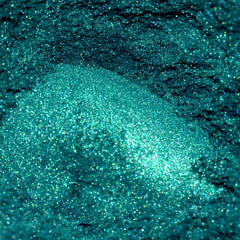 Teal glitter powder with sparkling texture and iridescent finish