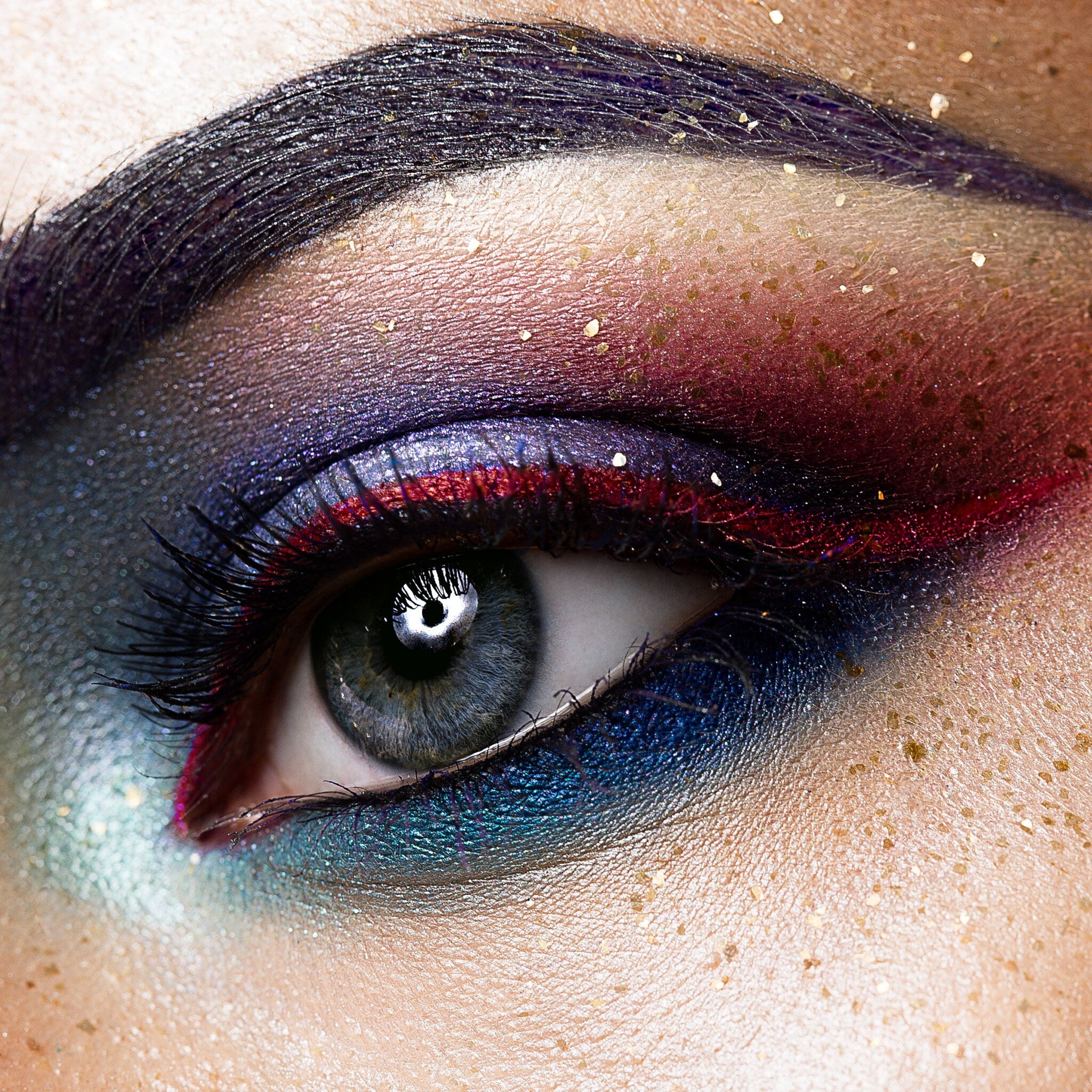 Side view of Bright Tone Eyeshadow Palette showing 12 vibrant powder shades in a sleek black compact