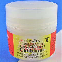 Homeopathic cream jar with white plastic lid, yellow and red label, BERWITZ text visible