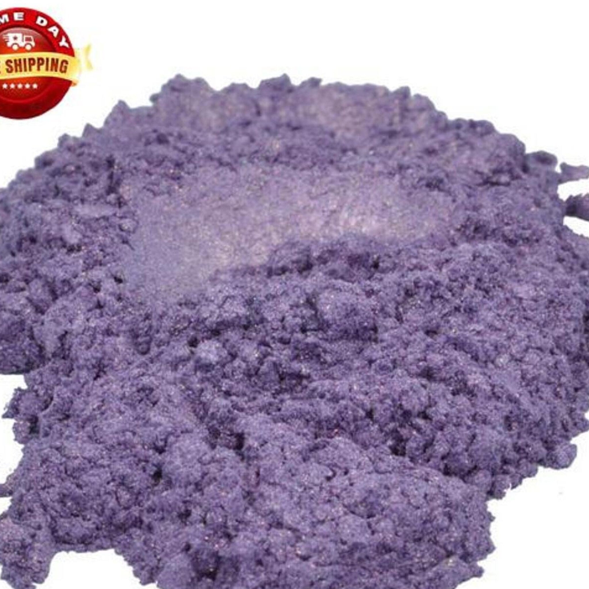 Close-up of amethyst purple mica powder in a sleek glass jar with gold lid, shimmering under light